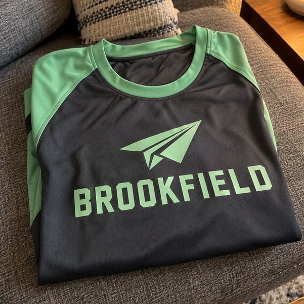 Customer photo of a custom soccer jersey on a couch
